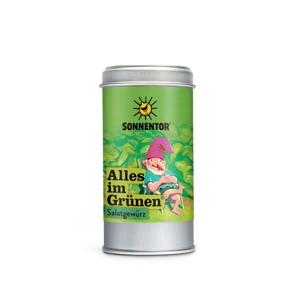 Photo of a spice tin Just Greens Salad Seasoning Organic Spice Blossom Blend. On the spice tin is a illustration in which a dwarf sits in a garden chair.